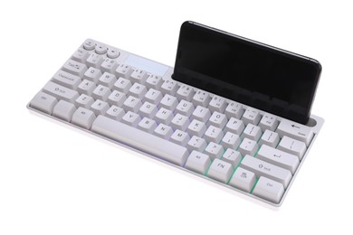 Photo of Modern computer keyboard with RGB lighting and smartphone isolated on white