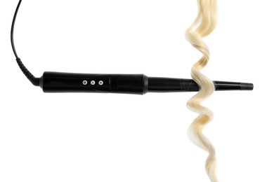 Photo of Curling iron with blonde hair lock isolated on white
