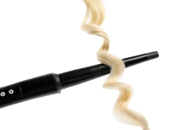 Photo of Curling iron with blonde hair lock isolated on white