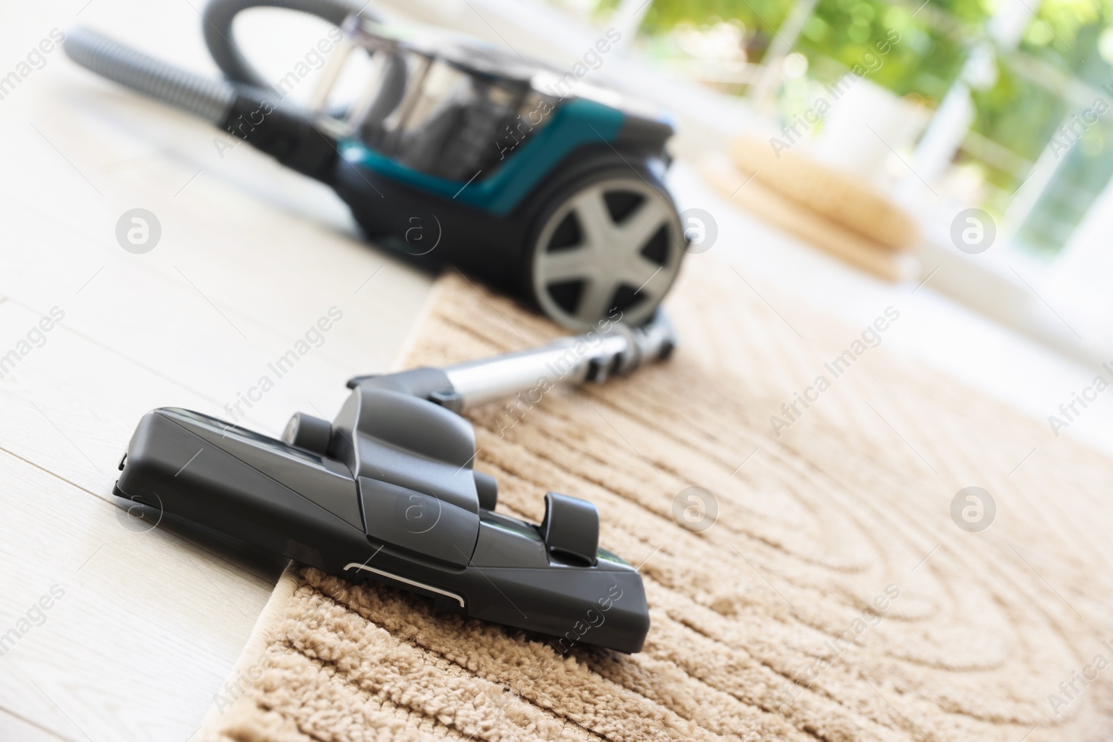 One vacuum cleaner on floor indoors, closeup Photo of One vacuum cleaner on floor indoors, closeup