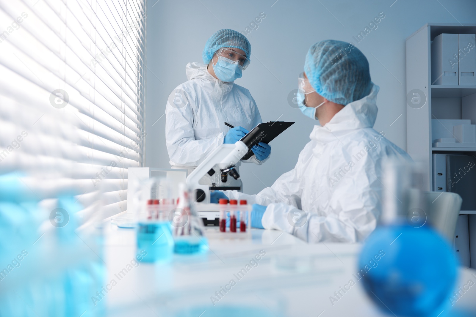 Medical analysis. Two scientists working in laboratory Photo of Medical analysis. Two scientists working in laboratory