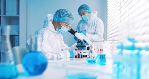 Photo of Medical analysis. Two scientists working in laboratory