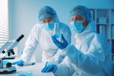 Photo of Medical analysis. Two scientists working with sample in laboratory