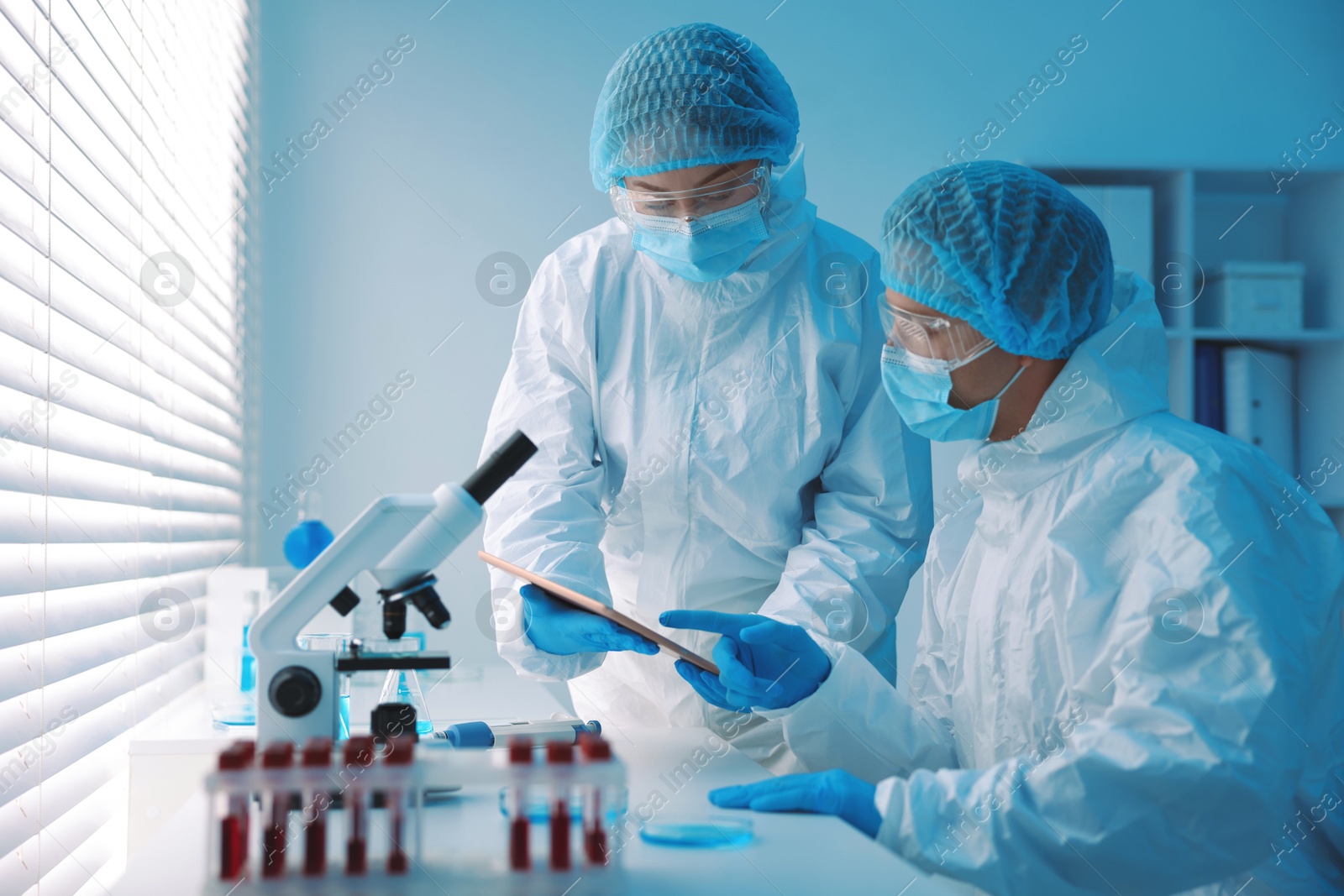 Medical analysis. Two Scientists working in laboratory Photo of Medical analysis. Two Scientists working in laboratory