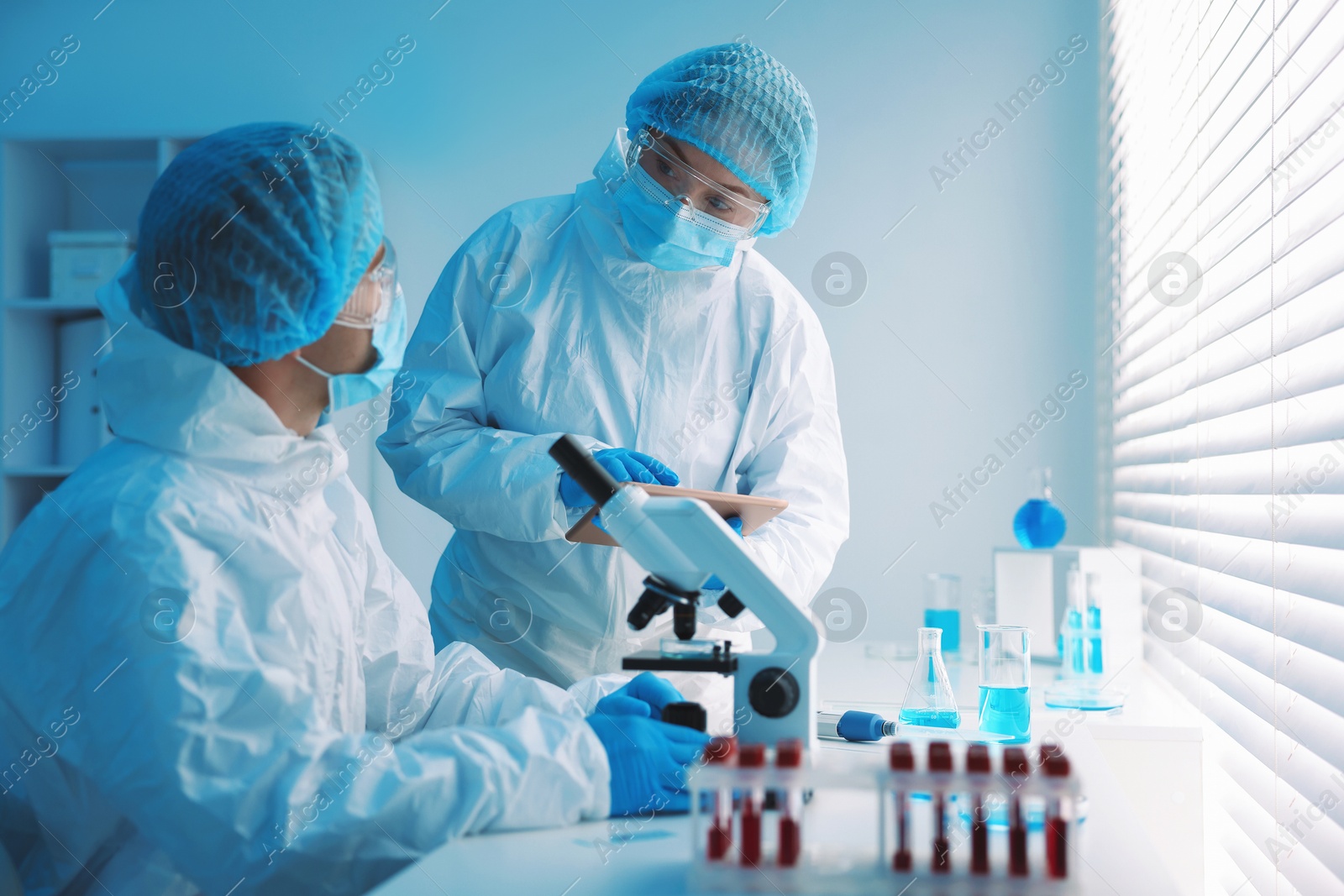 Medical analysis. Two Scientists working in laboratory Photo of Medical analysis. Two Scientists working in laboratory