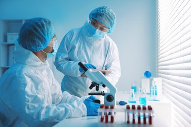 Photo of Medical analysis. Two Scientists working in laboratory