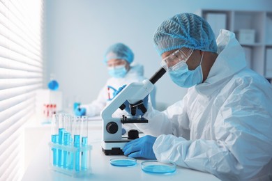 Photo of Medical analysis. Scientists working with samples in laboratory, selective focus