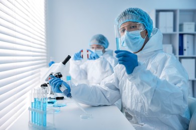 Photo of Medical analysis. Scientists working with samples in laboratory, selective focus