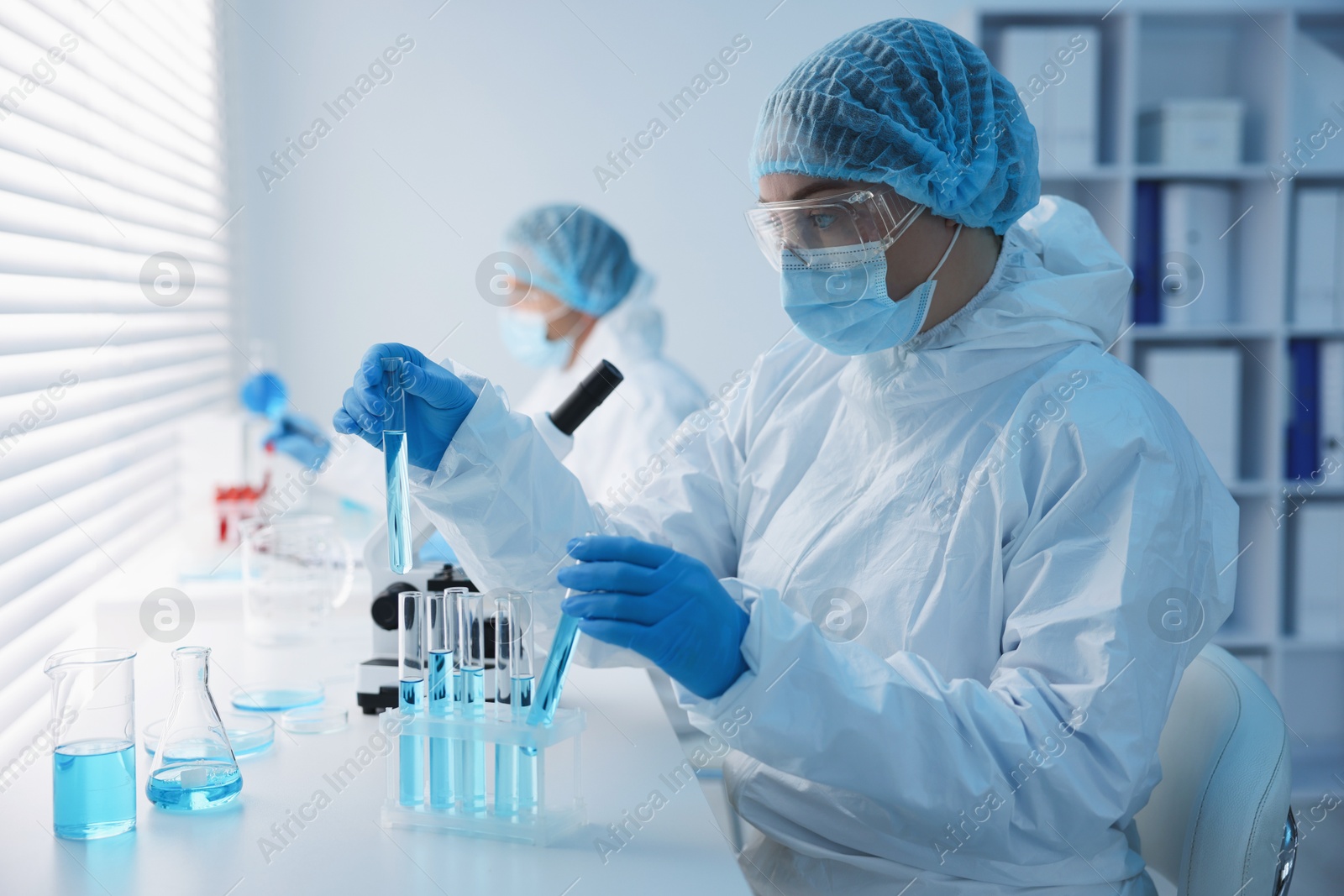 Medical analysis. Scientists working with samples in laboratory, selective focus Photo of Medical analysis. Scientists working with samples in laboratory, selective focus