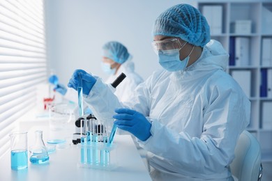 Photo of Medical analysis. Scientists working with samples in laboratory, selective focus