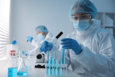 Photo of Medical analysis. Scientists working with samples in laboratory, selective focus