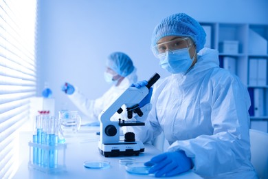 Photo of Medical analysis. Scientists working with samples in laboratory, selective focus