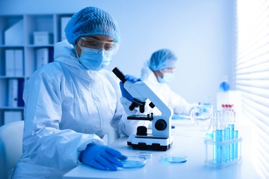 Photo of Medical analysis. Scientists working with samples in laboratory, selective focus