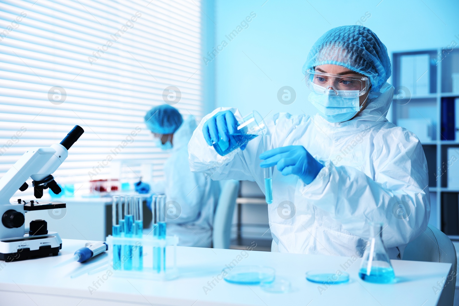 Medical analysis. Scientist working with sample in laboratory, selective focus Photo of Medical analysis. Scientist working with sample in laboratory, selective focus