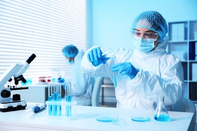 Photo of Medical analysis. Scientist working with sample in laboratory, selective focus