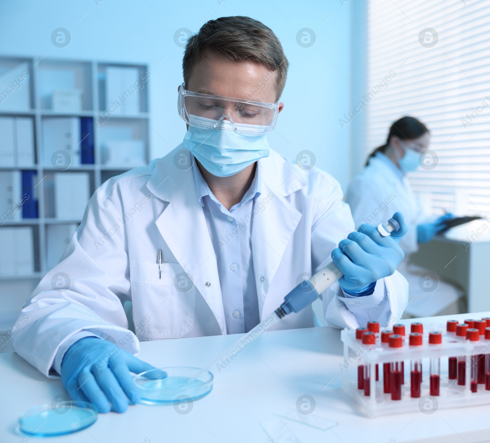 Medical analysis. Scientist working with sample in laboratory, selective focus Photo of Medical analysis. Scientist working with sample in laboratory, selective focus