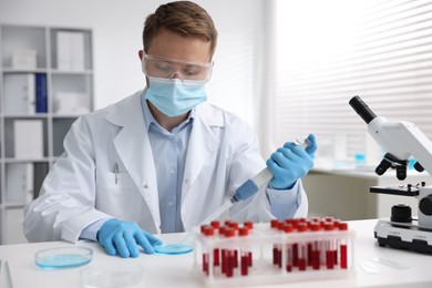 Photo of Medical analysis. Scientist working with sample in laboratory
