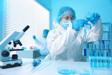 Photo of Medical analysis. Scientist working with sample in laboratory, selective focus