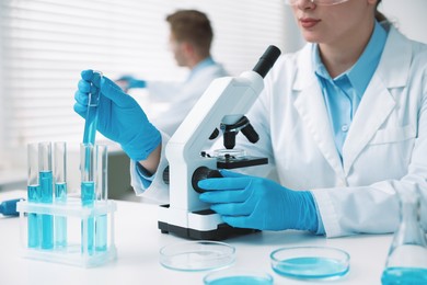 Photo of Medical analysis. Scientist working with sample in laboratory, selective focus