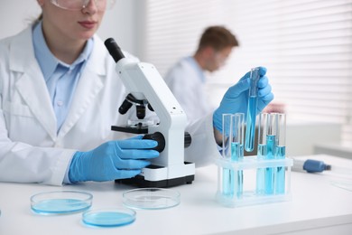 Photo of Medical analysis. Scientist working with sample in laboratory, selective focus