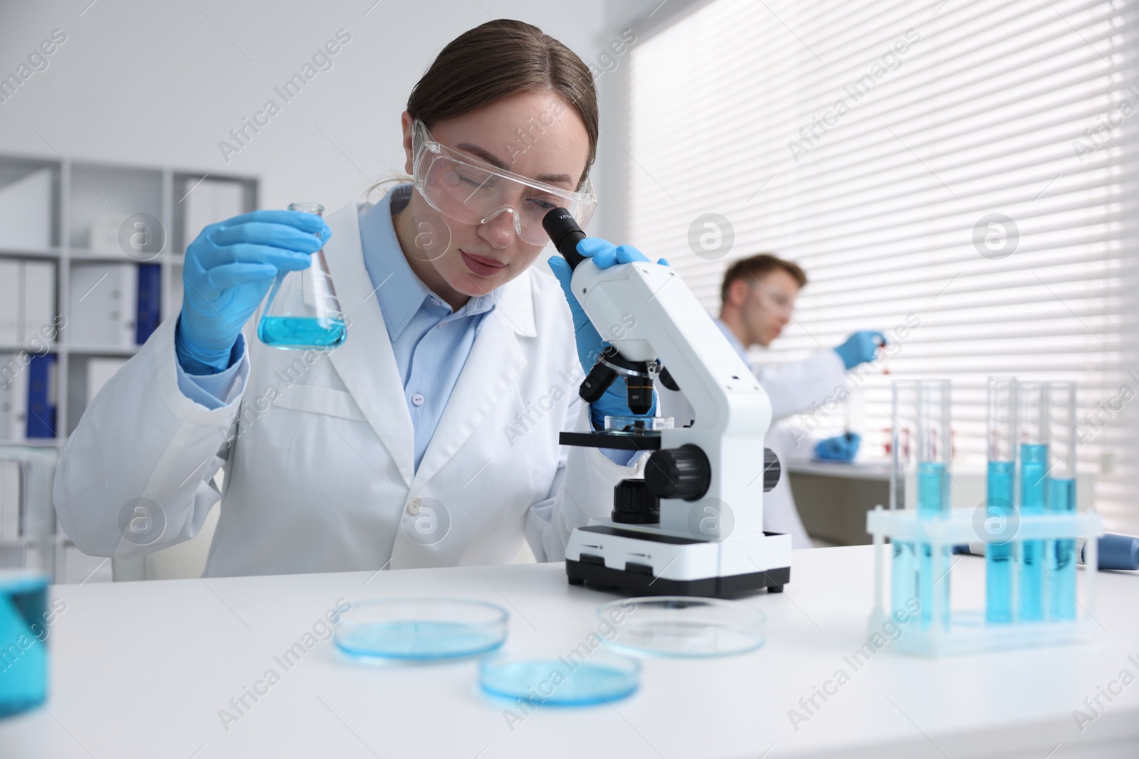 Medical analysis. Scientist working with sample in laboratory, selective focus Photo of Medical analysis. Scientist working with sample in laboratory, selective focus