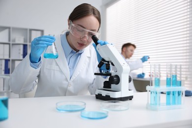 Photo of Medical analysis. Scientist working with sample in laboratory, selective focus