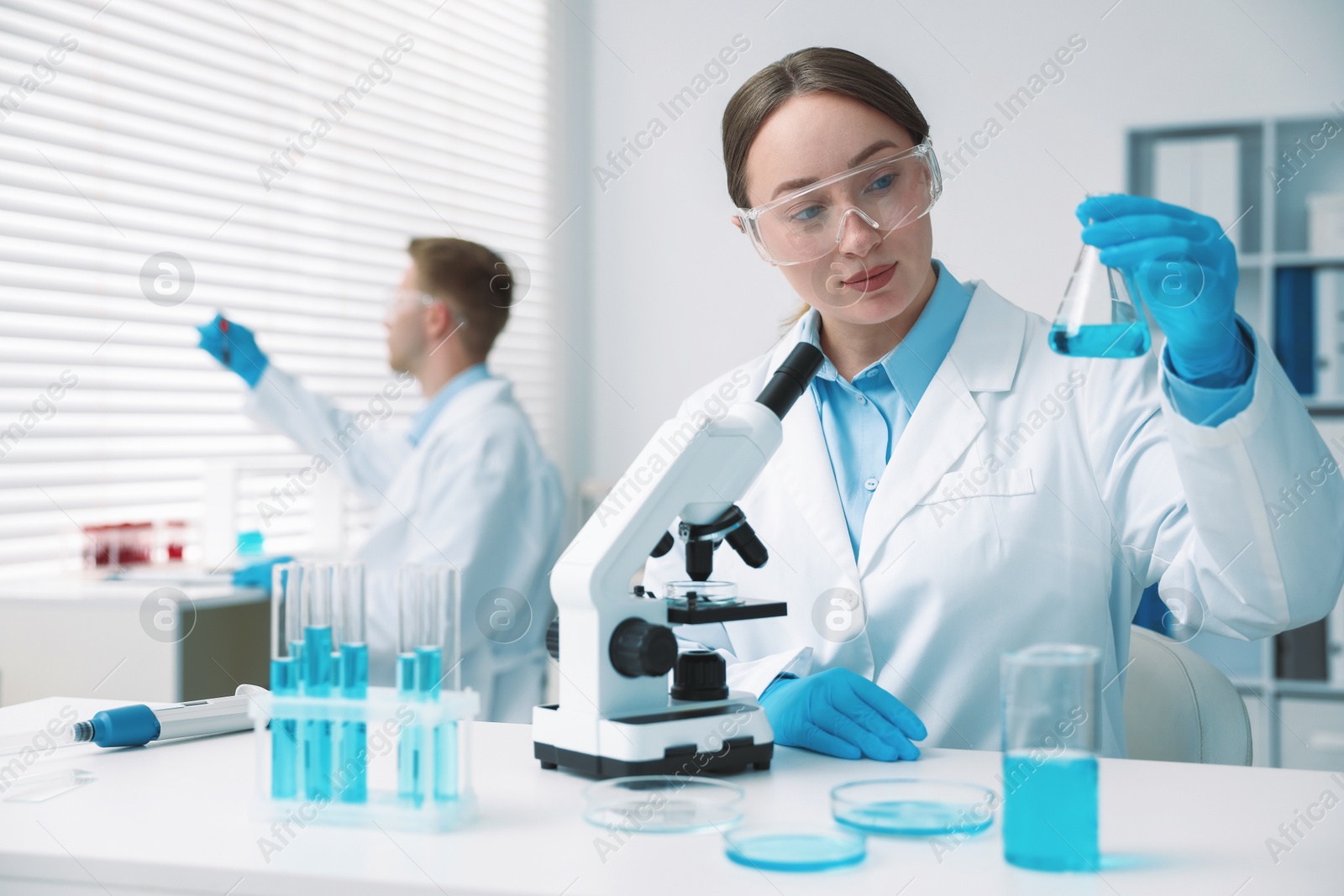 Medical analysis. Scientist working with sample in laboratory, selective focus Photo of Medical analysis. Scientist working with sample in laboratory, selective focus