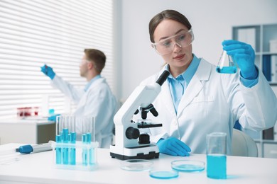 Photo of Medical analysis. Scientist working with sample in laboratory, selective focus