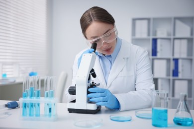Photo of Medical analysis. Scientist working with microscope in laboratory