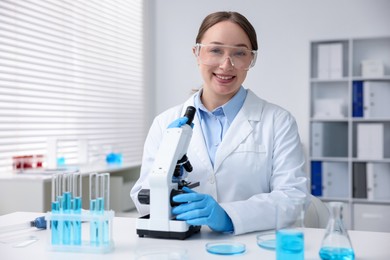 Photo of Medical analysis. Scientist working with microscope in laboratory