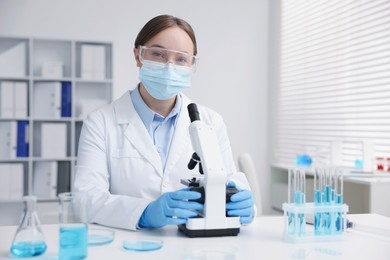 Photo of Medical analysis. Scientist working with microscope in laboratory
