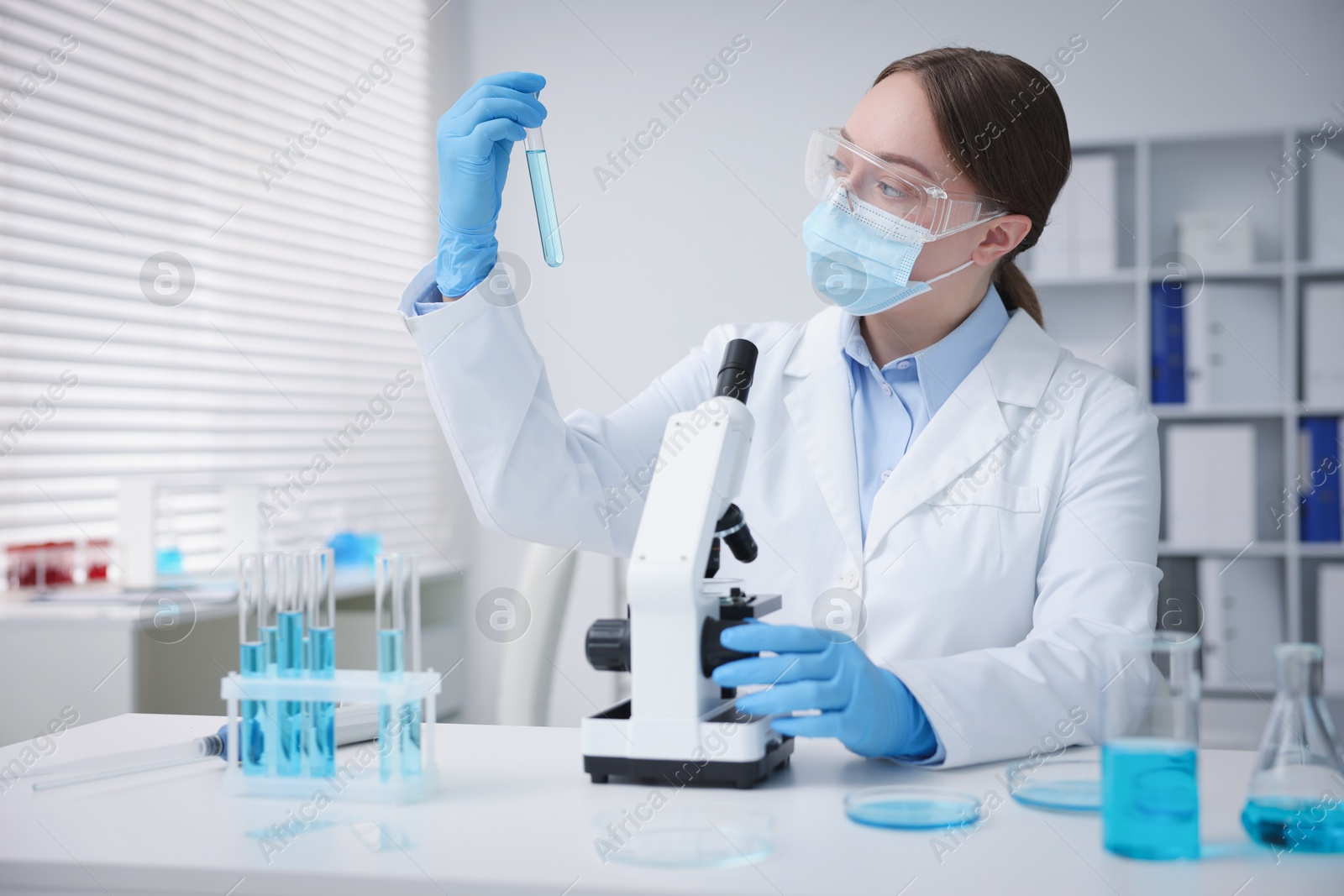 Medical analysis. Scientist working with sample in laboratory Photo of Medical analysis. Scientist working with sample in laboratory