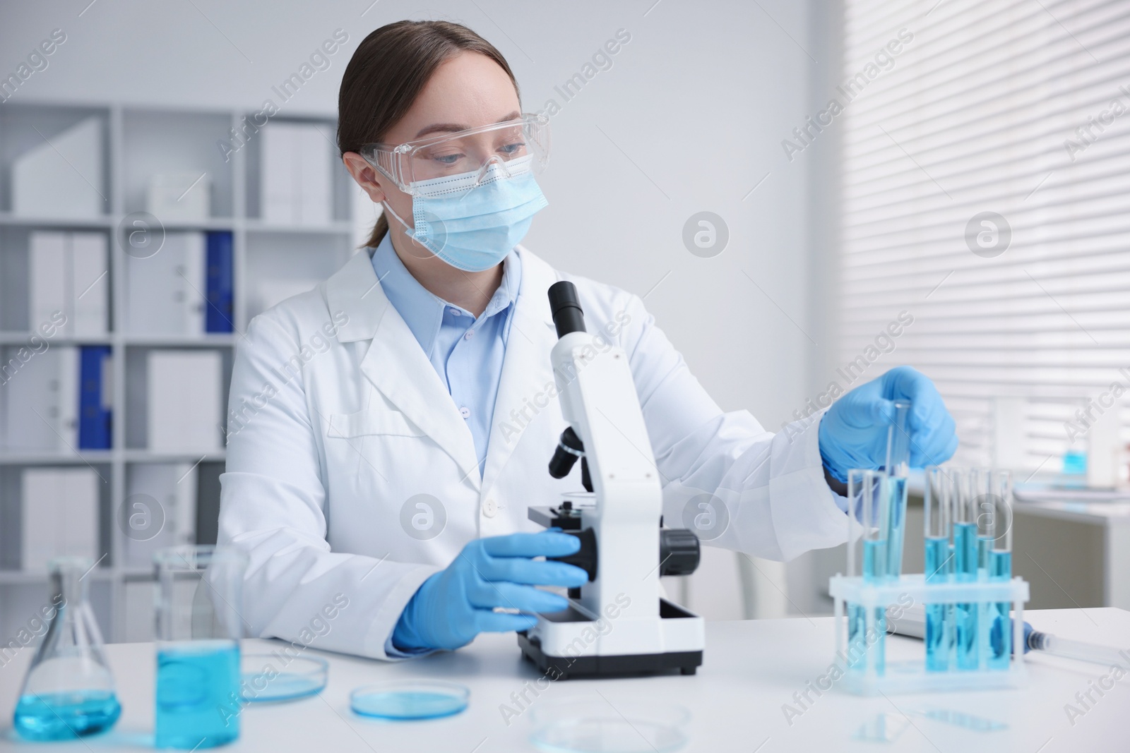 Medical analysis. Scientist working with sample in laboratory Photo of Medical analysis. Scientist working with sample in laboratory