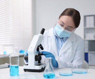 Photo of Medical analysis. Scientist working with microscope in laboratory