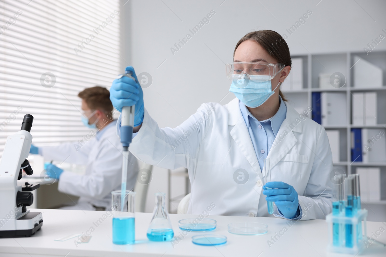 Medical analysis. Scientist working with sample in laboratory, selective focus Photo of Medical analysis. Scientist working with sample in laboratory, selective focus