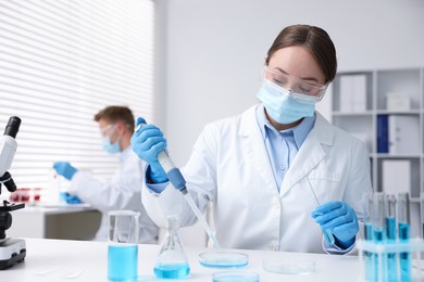 Photo of Medical analysis. Scientist working with sample in laboratory, selective focus