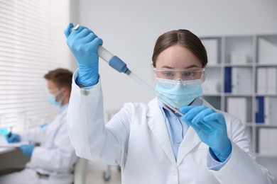 Photo of Medical analysis. Scientist working with sample in laboratory, selective focus