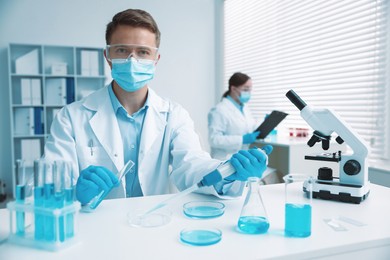 Photo of Medical analysis. Scientist working with sample in laboratory, selective focus