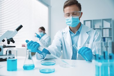 Photo of Medical analysis. Scientist working with sample in laboratory, selective focus