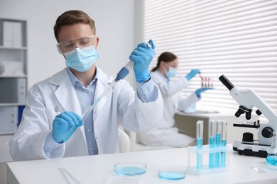 Photo of Medical analysis. Scientist working with sample in laboratory, selective focus