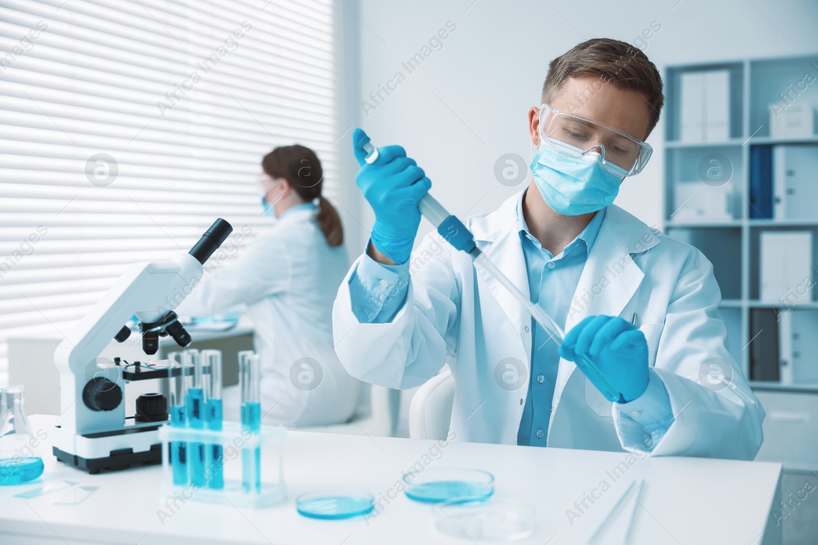Medical analysis. Scientist working with sample in laboratory, selective focus Photo of Medical analysis. Scientist working with sample in laboratory, selective focus