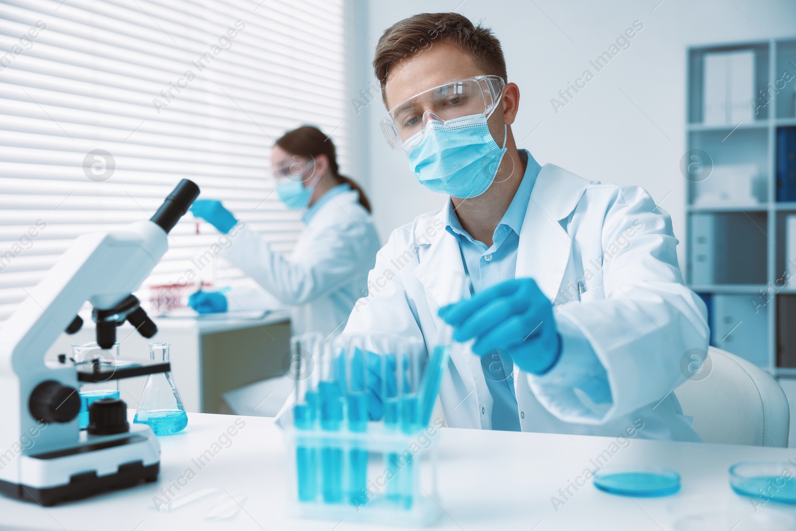 Medical analysis. Scientist working with sample in laboratory, selective focus Photo of Medical analysis. Scientist working with sample in laboratory, selective focus