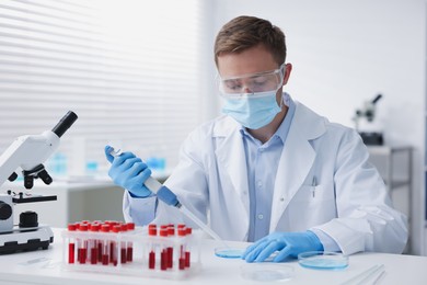 Photo of Medical analysis. Scientist working with sample in laboratory
