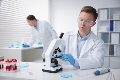 Photo of Medical analysis. Scientists working with samples in laboratory, selective focus
