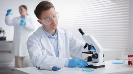 Photo of Medical analysis. Scientists working with samples in laboratory, selective focus
