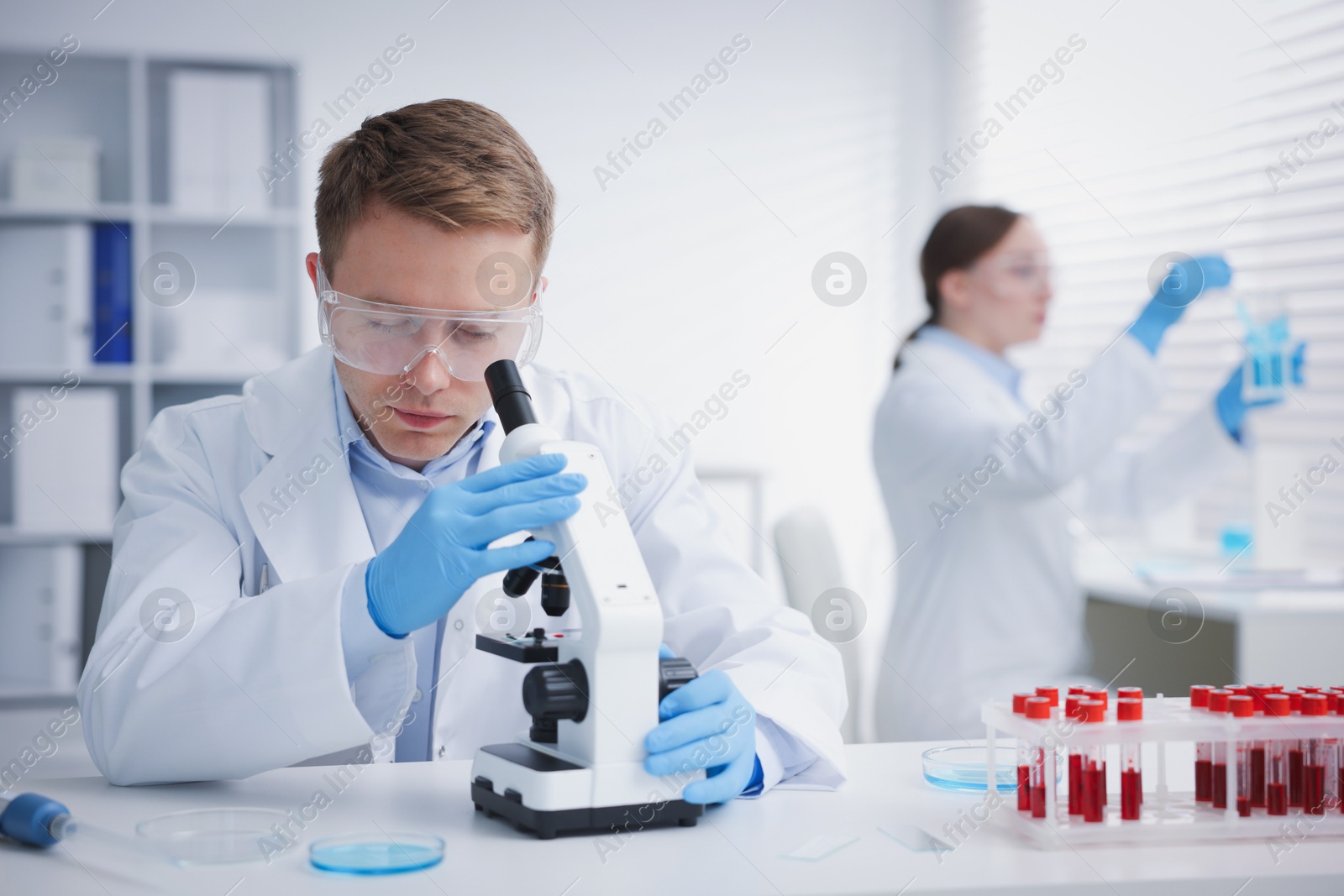 Medical analysis. Scientists working with samples in laboratory, selective focus Photo of Medical analysis. Scientists working with samples in laboratory, selective focus