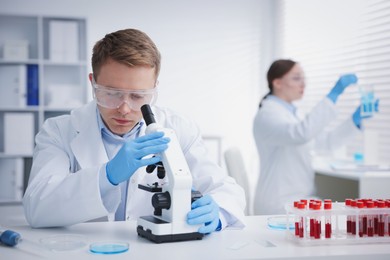 Photo of Medical analysis. Scientists working with samples in laboratory, selective focus