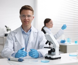 Photo of Medical analysis. Scientists working with samples in laboratory, selective focus