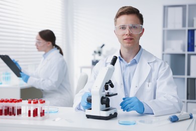 Photo of Medical analysis. Scientists working with samples in laboratory, selective focus