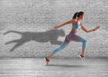 Image of Athletic young woman running. Her shadow in form of cheetah on brick wall. Sports poster